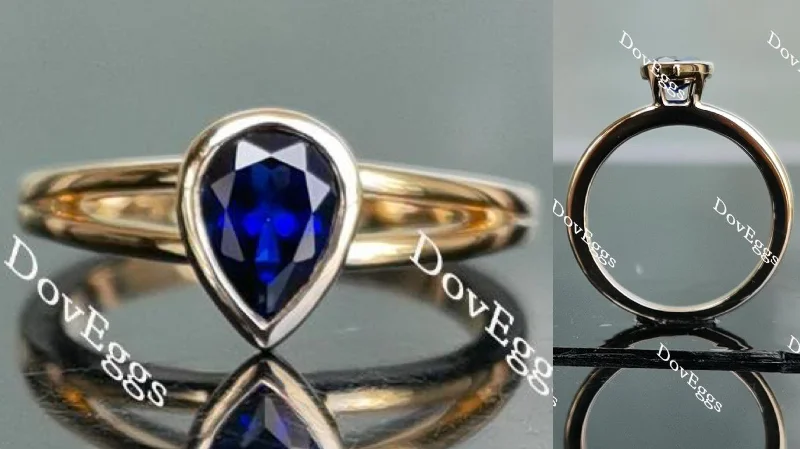 Modern rings for women-Doveggs pear bezel setting split shank intense royal blue sapphire colored gem ring